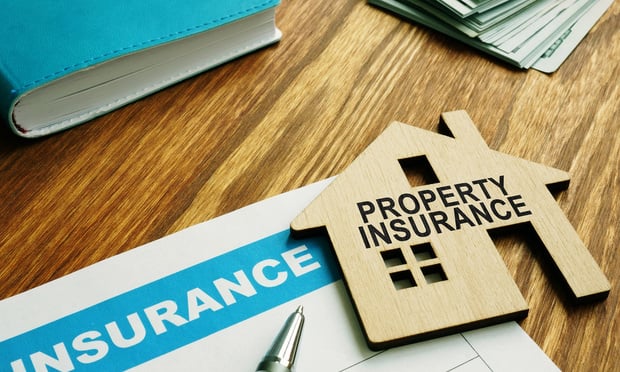 A new report says that in response to higher insurance premiums, commercial property owners are retaining additional financial risk while working to assemble a cadre of multiple insurers to provide the coverage levels needed. (Credit: Vitalii Vodolazskyi/Adobe Stock)