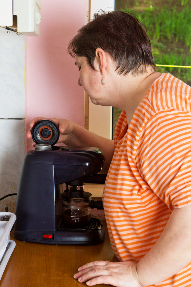 Woman making coffee