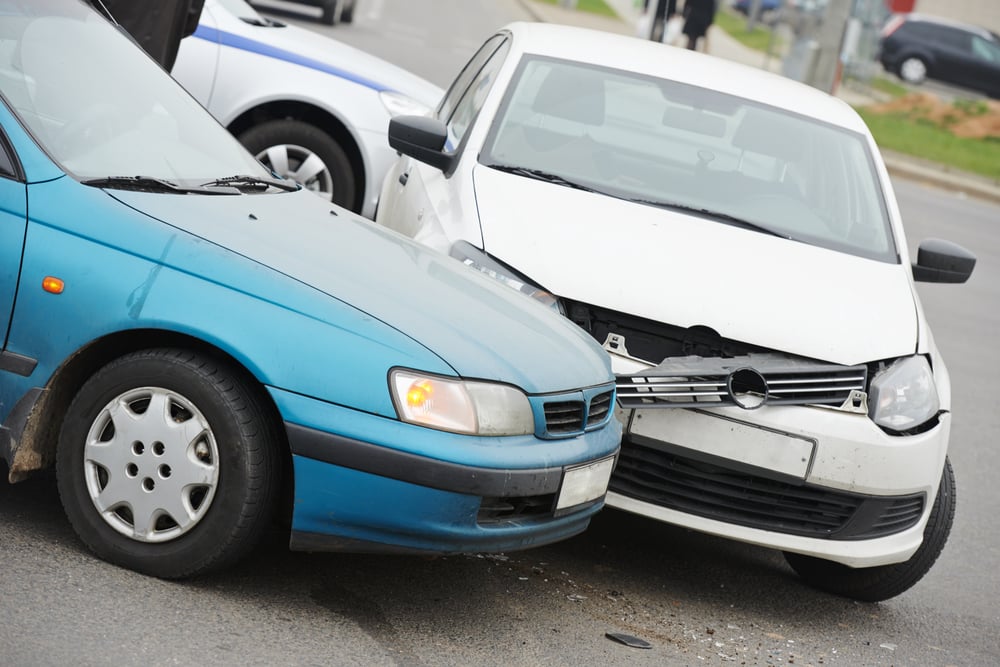 Two cars in front end collision