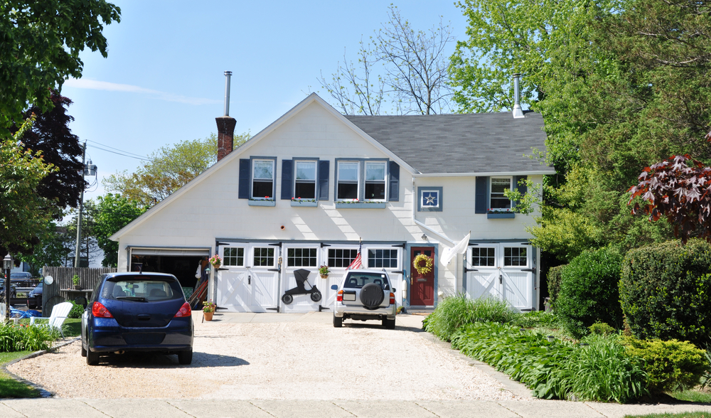 house with 2 cars in driveway