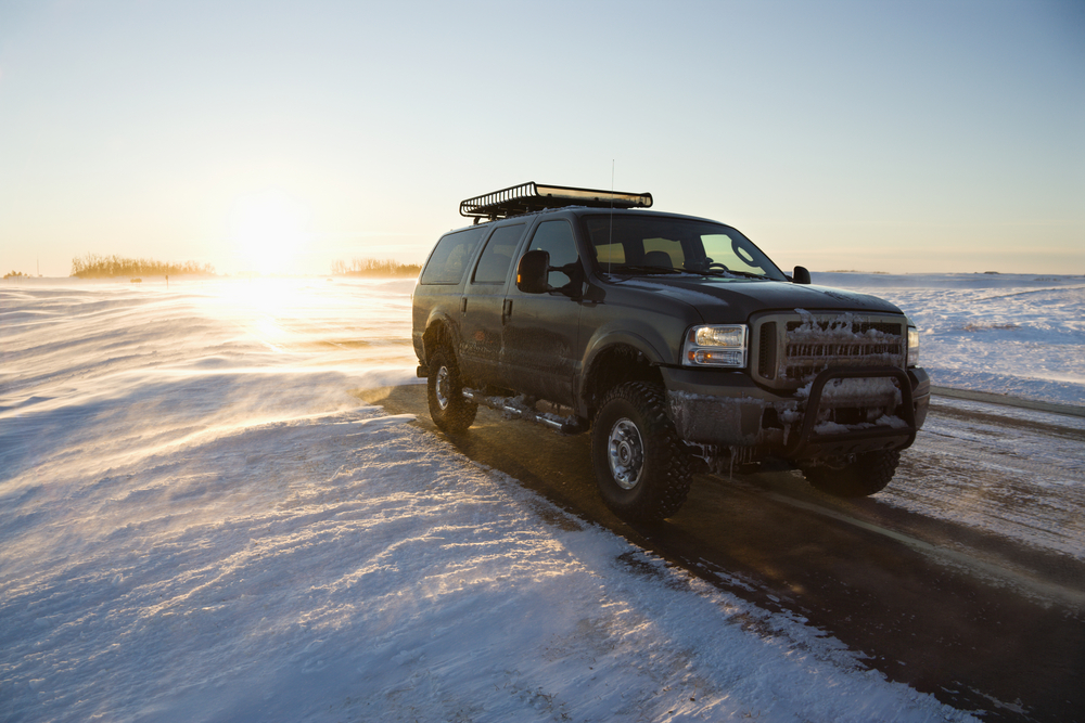 Four wheel drive vehicle driving in snow