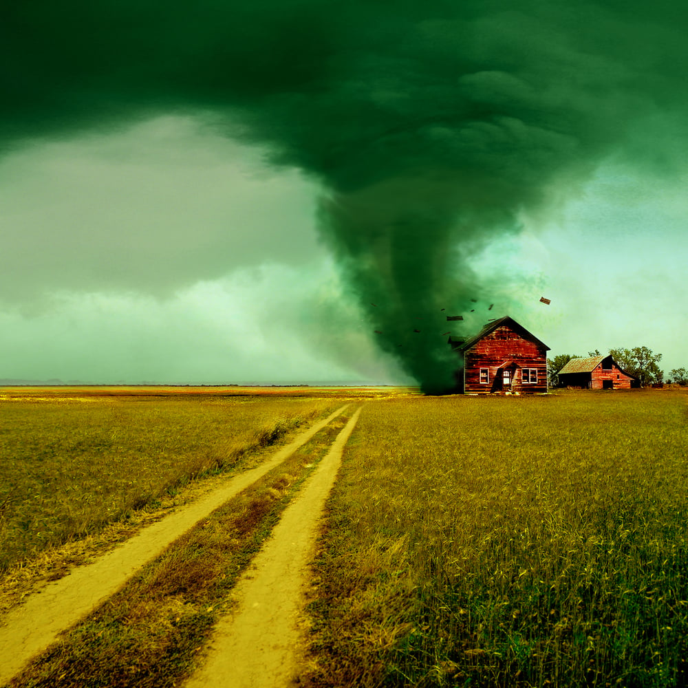 tornado near a farm house