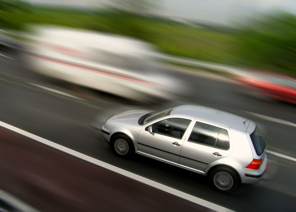 speeding silver car