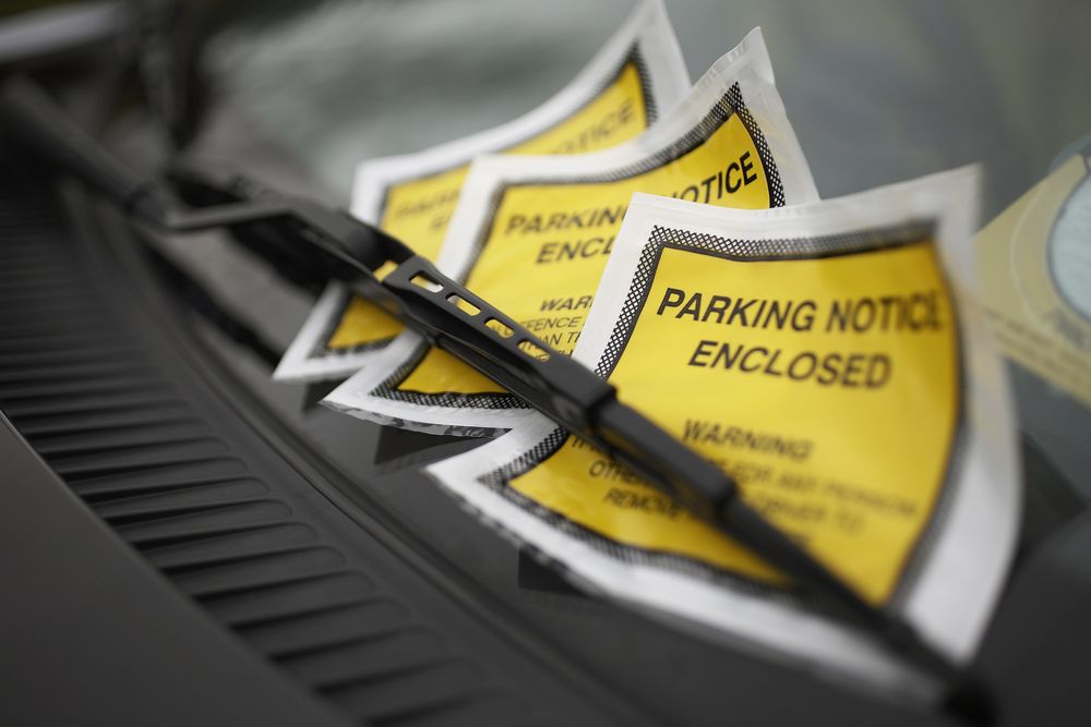 parking tickets under car windshield wiper