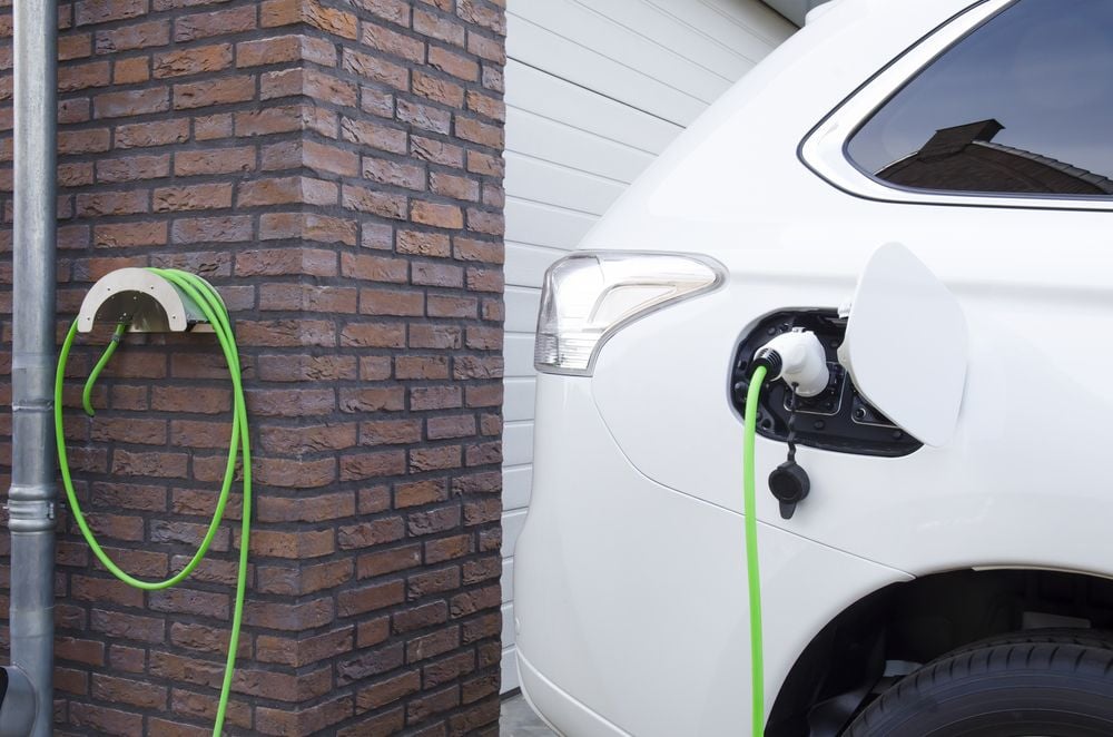 electric car charging in home driveway