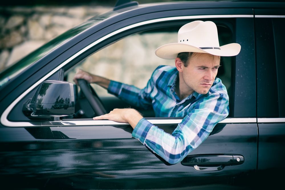 cowboy backing up vehicle