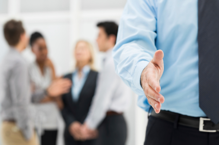 businessman extending hand to shake