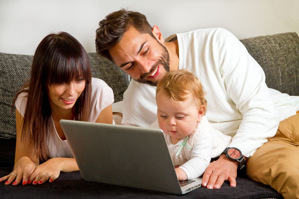 family shopping for car insurance on laptop