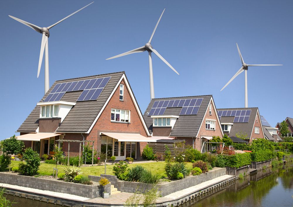 homes with solar panels and wind turbines nearby