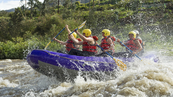 group of people whitewater rafting