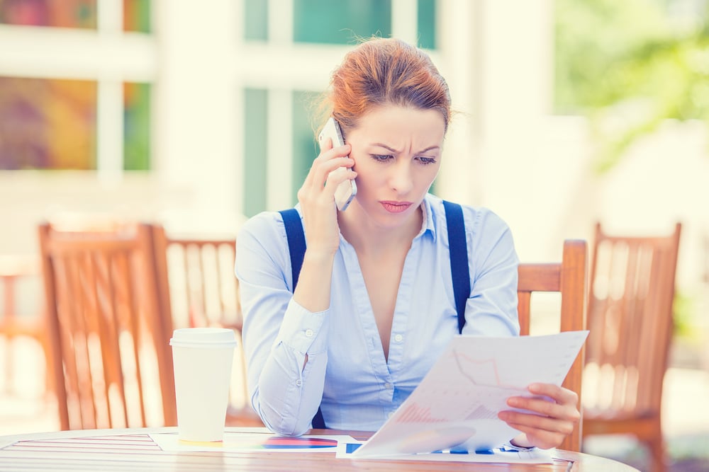 Woman-on-phone-at-table-outside-unhappy-SS-PathDoc