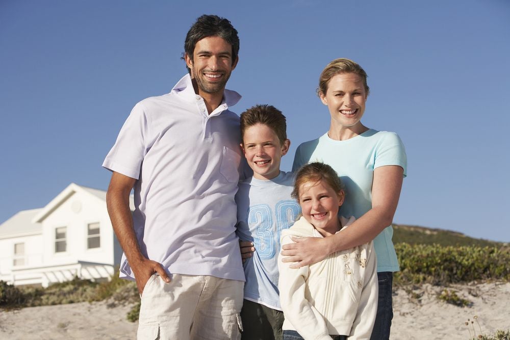 family at vacation beach house