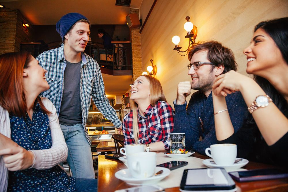 group of millennials at a cafe