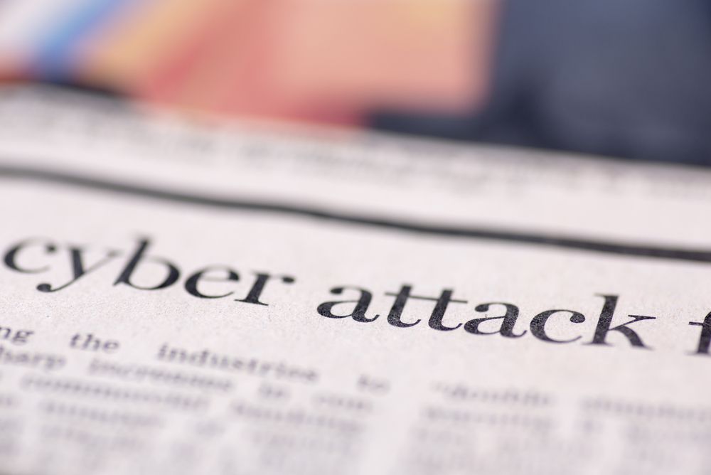 newspaper headline about cyber attack