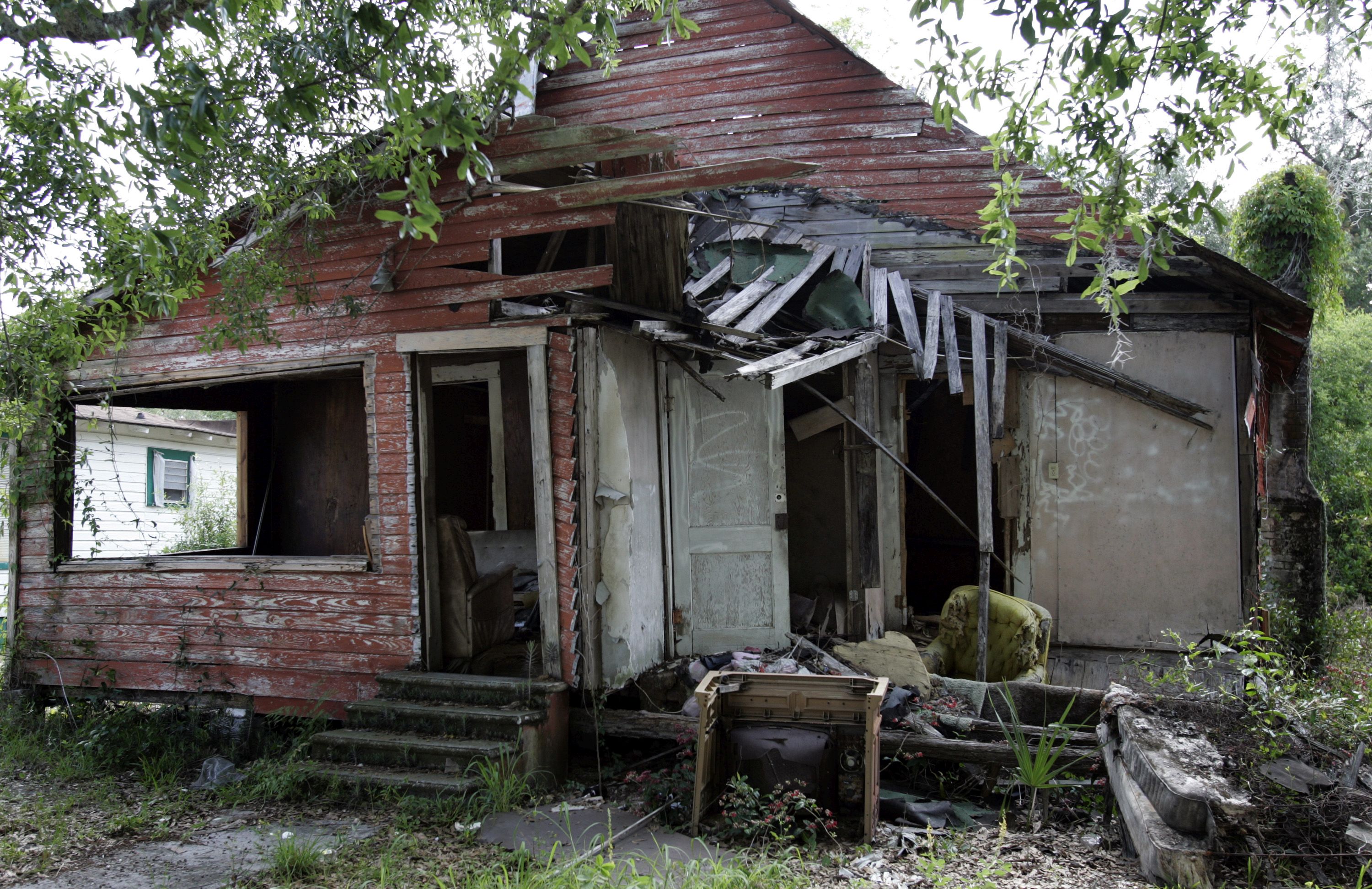 An abandoned home damaged by Hurricane Charley