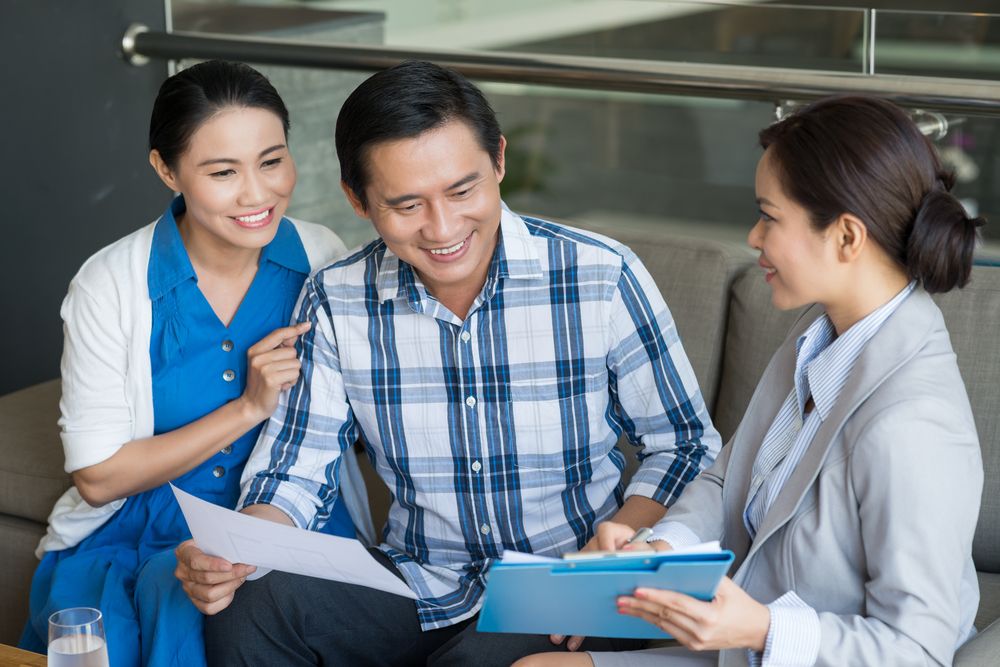 Female insurance professional working with clients