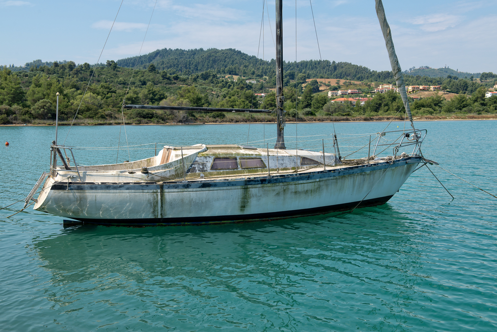 Dirty-looking-sailboat-in-need-of-repair-shutterstock_198393407-Roy Pedersen