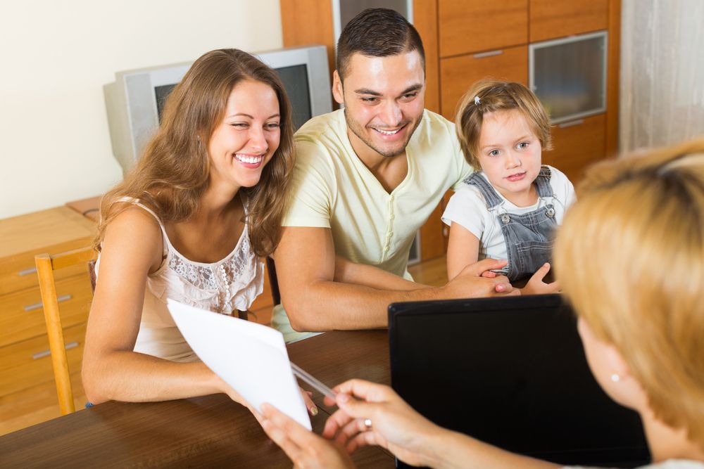 insurance agent talking to a family