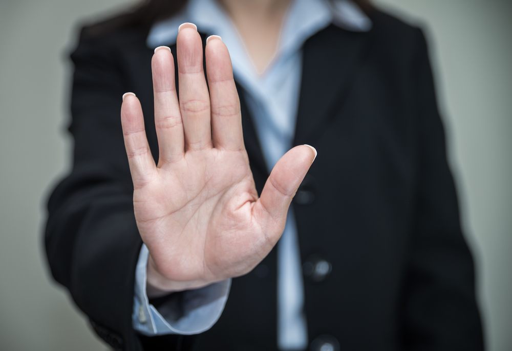 Women holding up palm of her hand