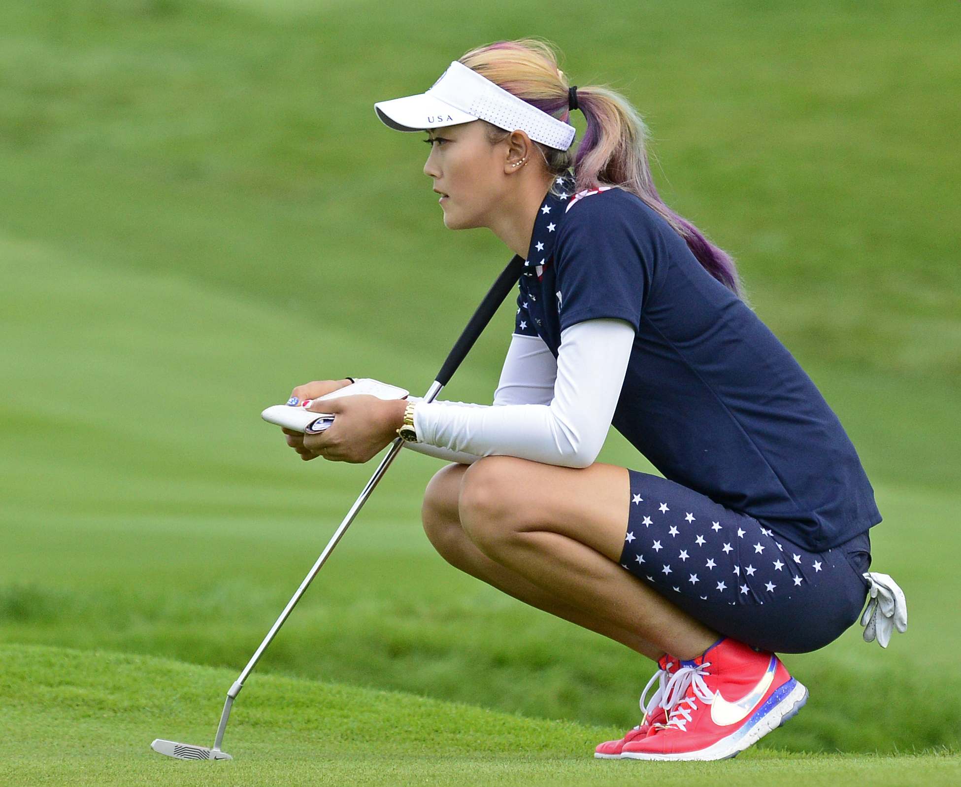 Michelle Wie concentratesat the Solheim Cup golf tournament