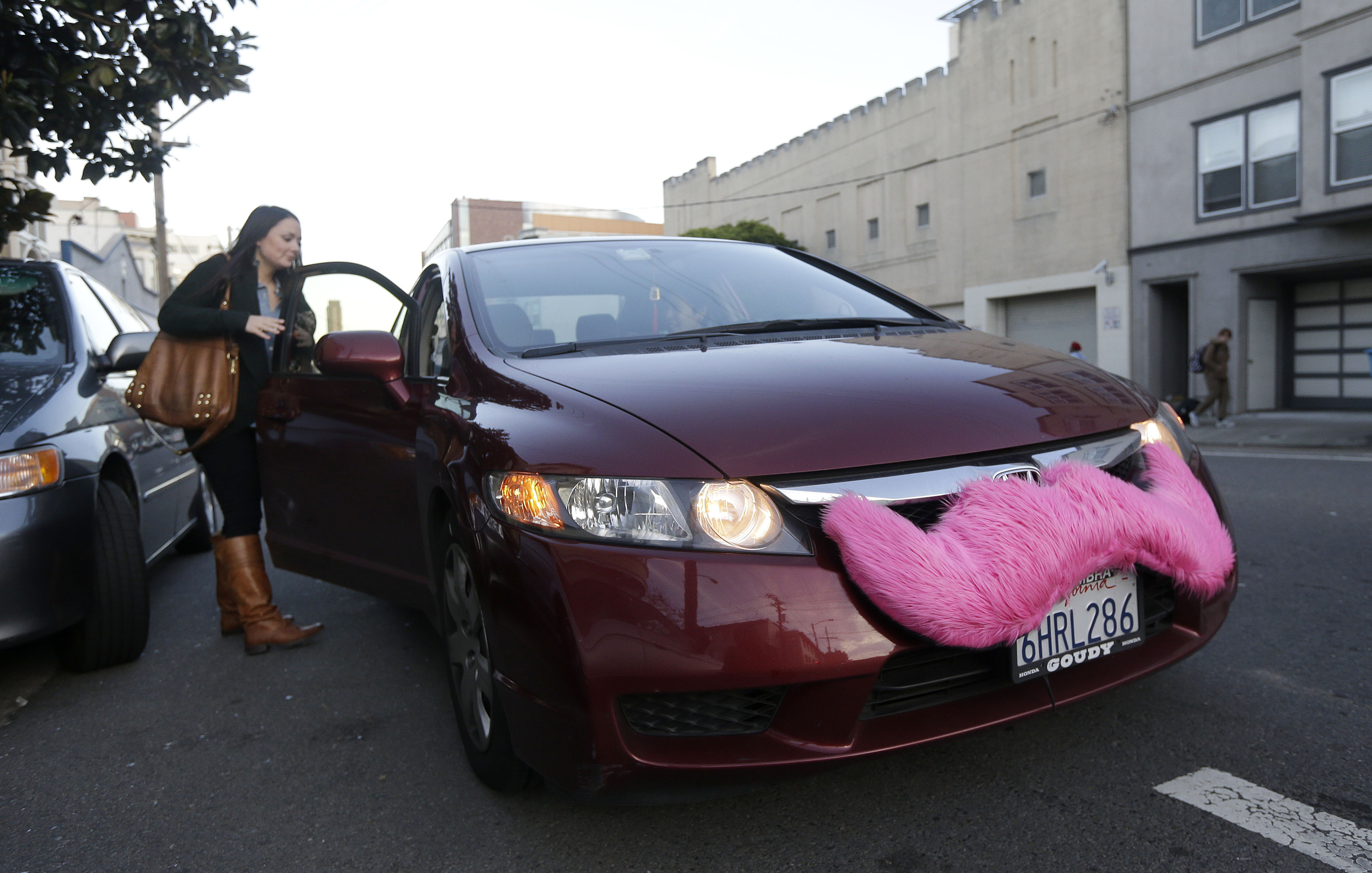 Passenger-getting-into-Lyft-car-AP