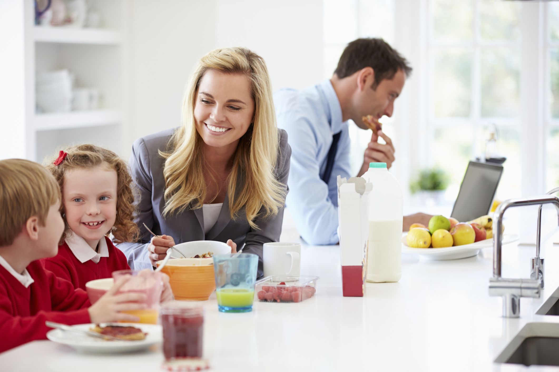 professional woman and her family at breakfast