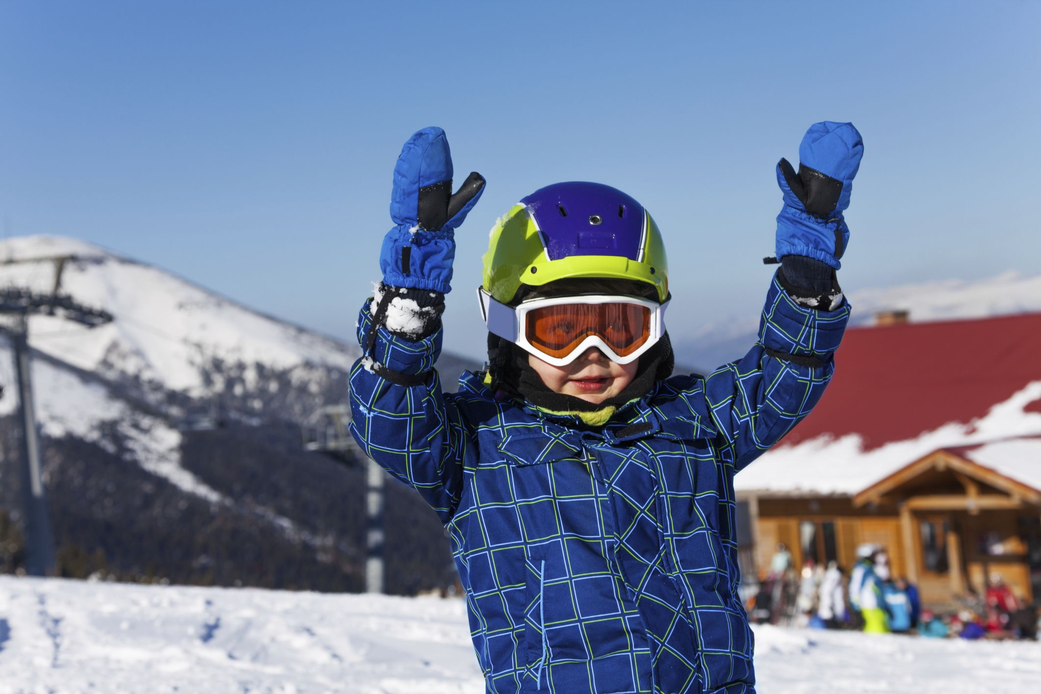 Smiling kid in ski helmet and googles