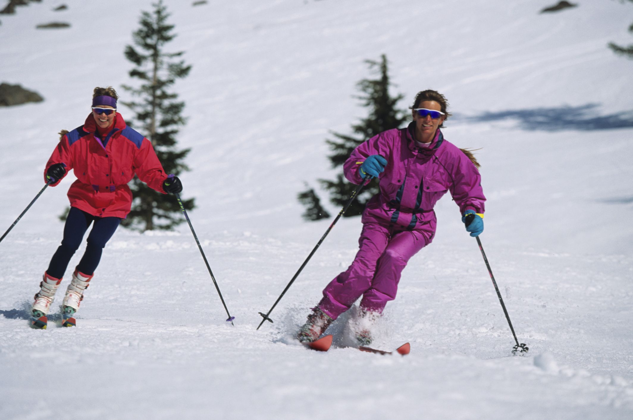 pair of female skiers