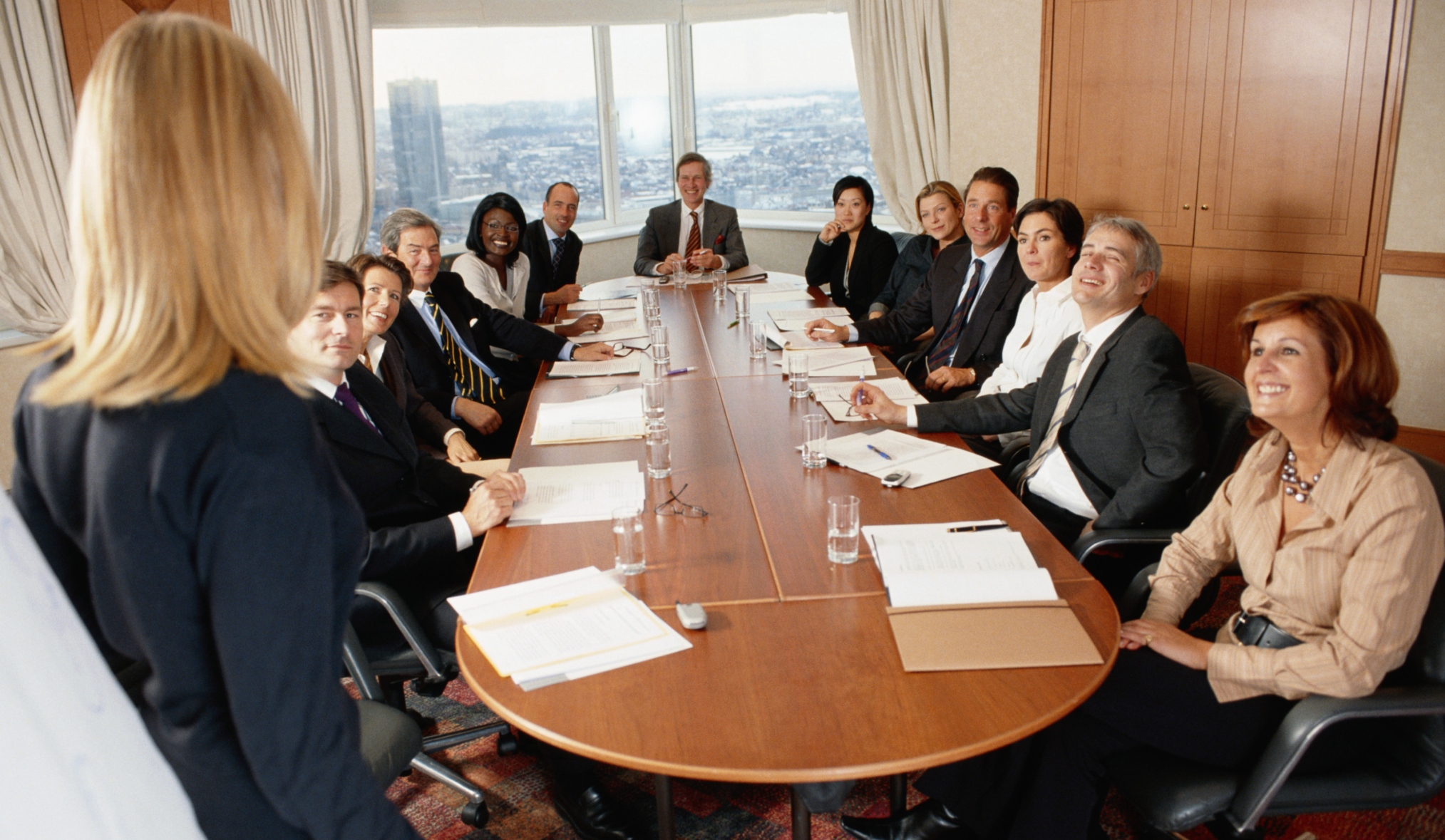 Business-woman-making-presentation-to-board-members-in-conference-room-ThinkstockPhotos-200238528-001-David De Lossy