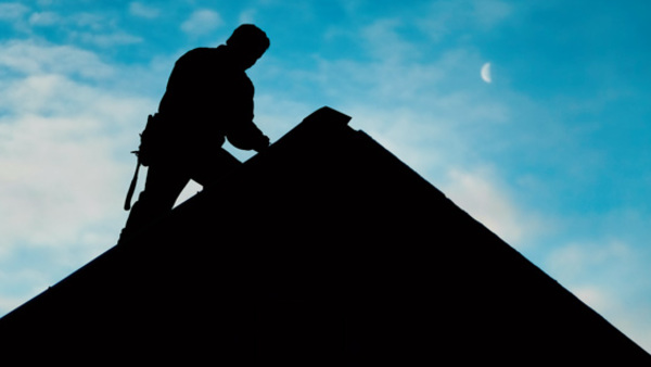 Man-on-peak-of-roof