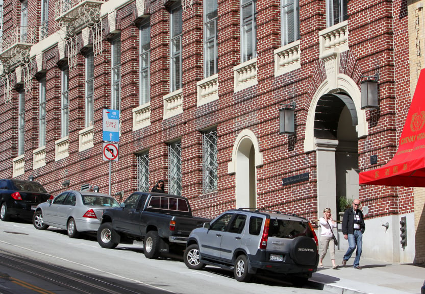 Cars parked on a hill