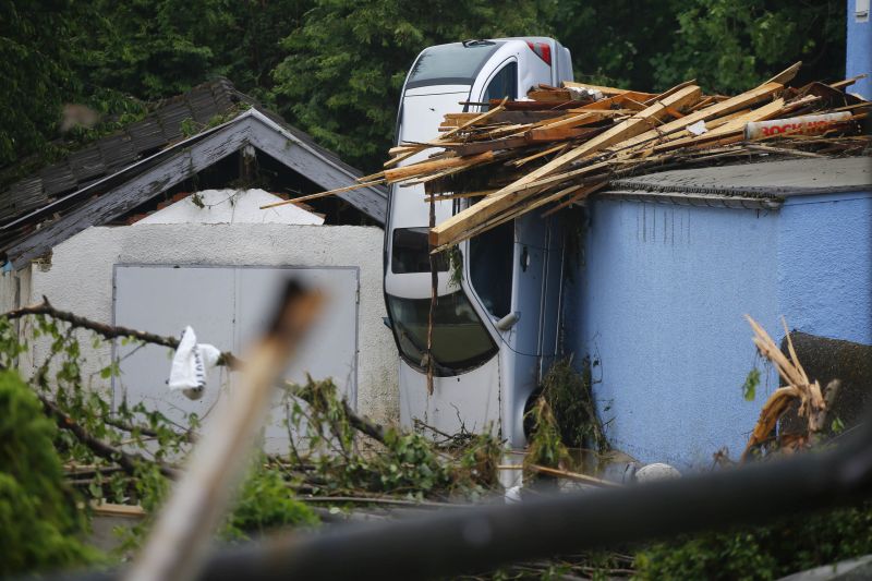 A car is squeezed between houses after the small town was hit by flooding in Simbach am Inn, Germany