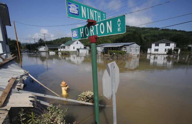 Flooded homes are still surrounded by water in Rainelle, W. Va.