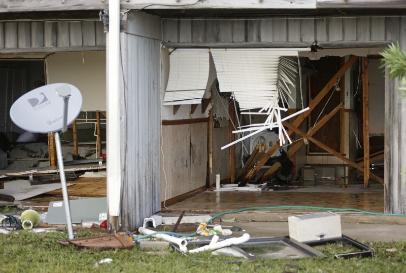  front of a residence that was destroyed by Hurricane Hermine 