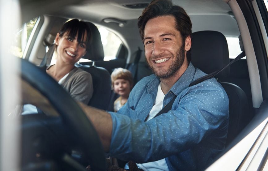 man driving his family