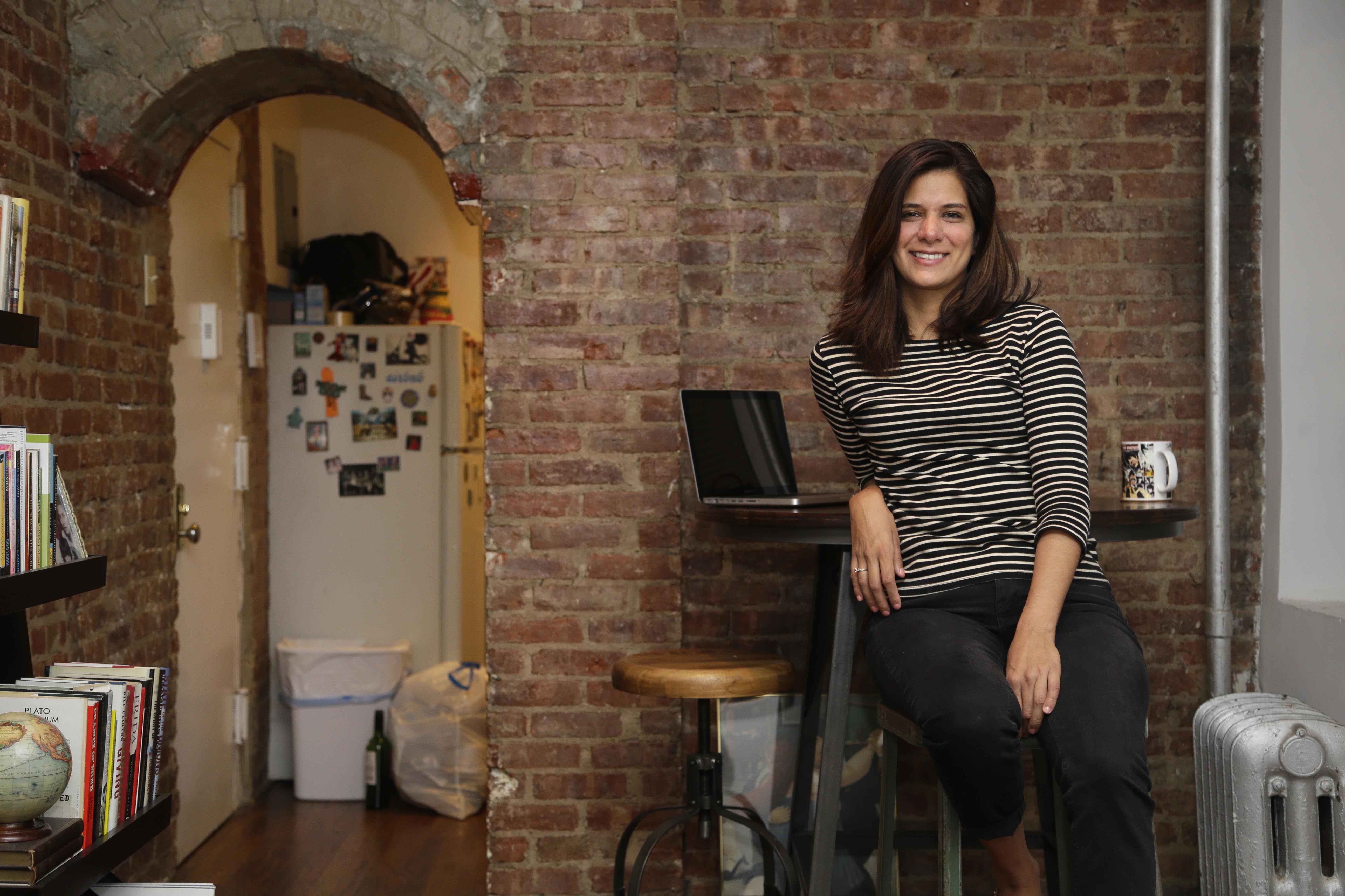 Woman in her apartment -- Airbnb