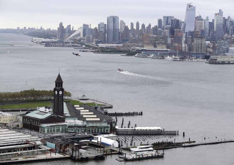 The Hoboken station, left, with the New York City skyline in the background, is seen from Jersey City, N.J.