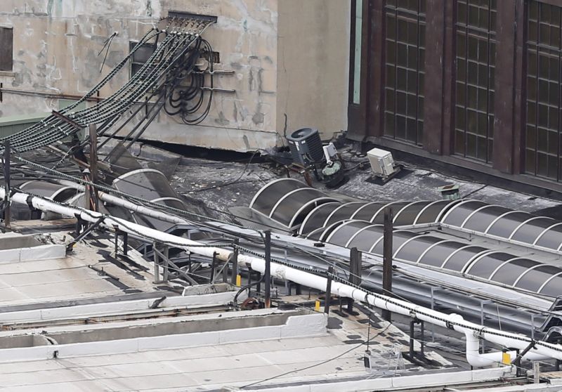 Damage is seen on a section of the roof of the Hoboken station 