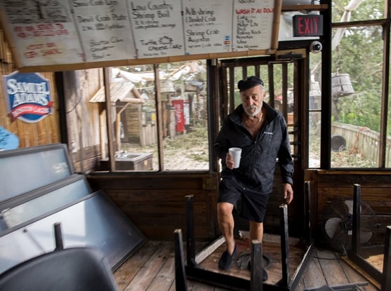 Restaurant owner assessing damage Hurricane Matthew