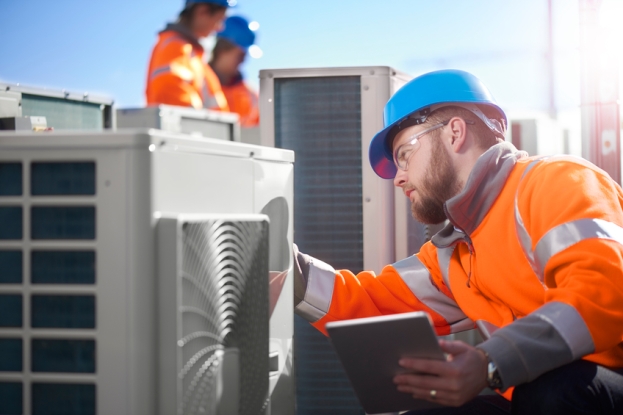 Engineer inspecting HVAC system