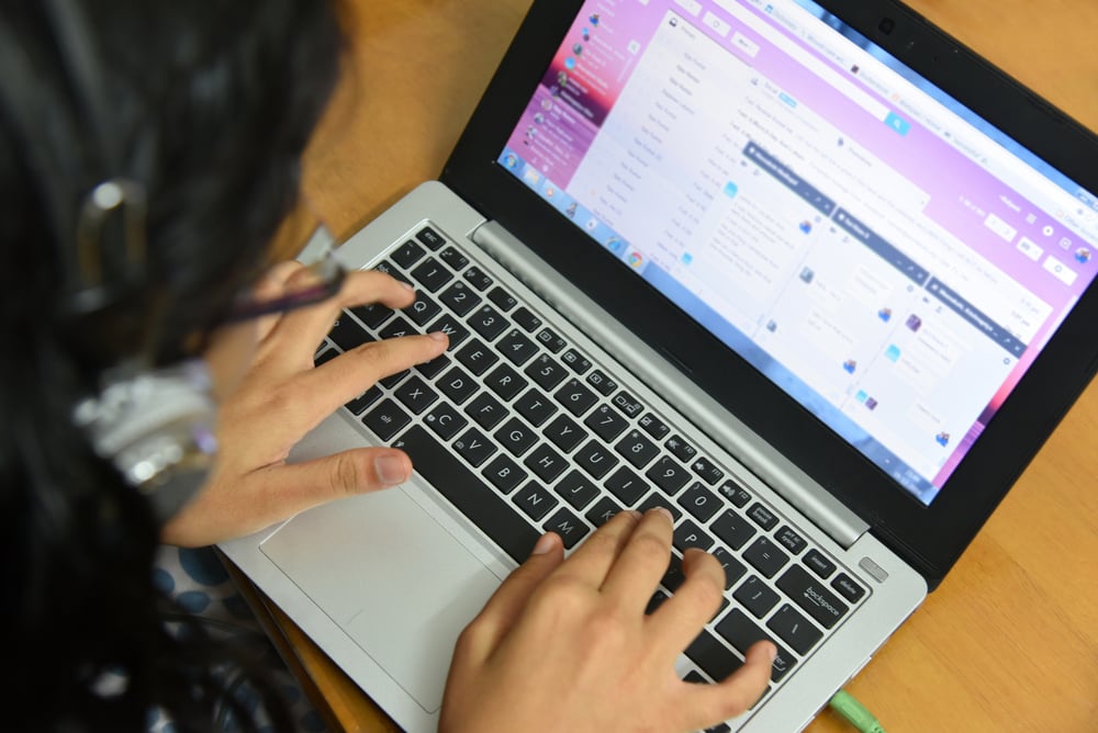 woman conducting data analytics on a computer