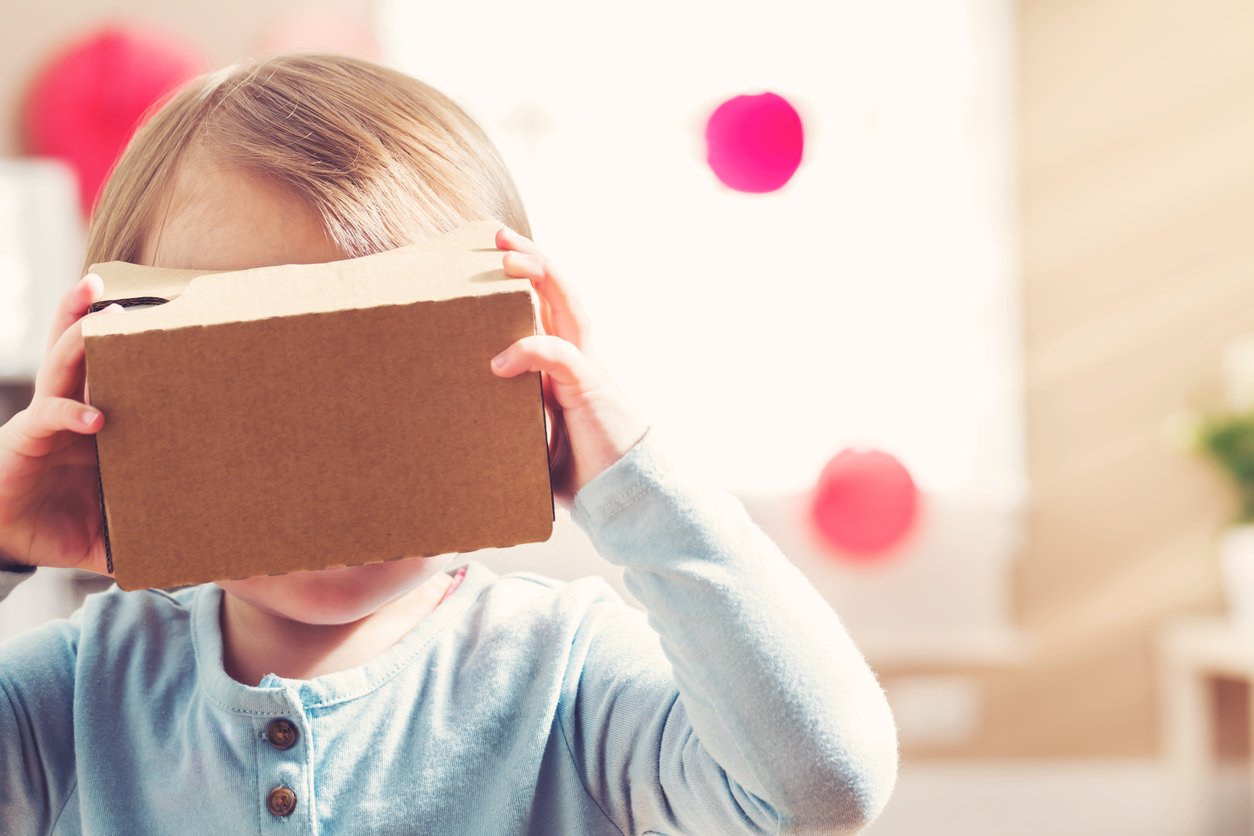 Child using virtual reality goggles