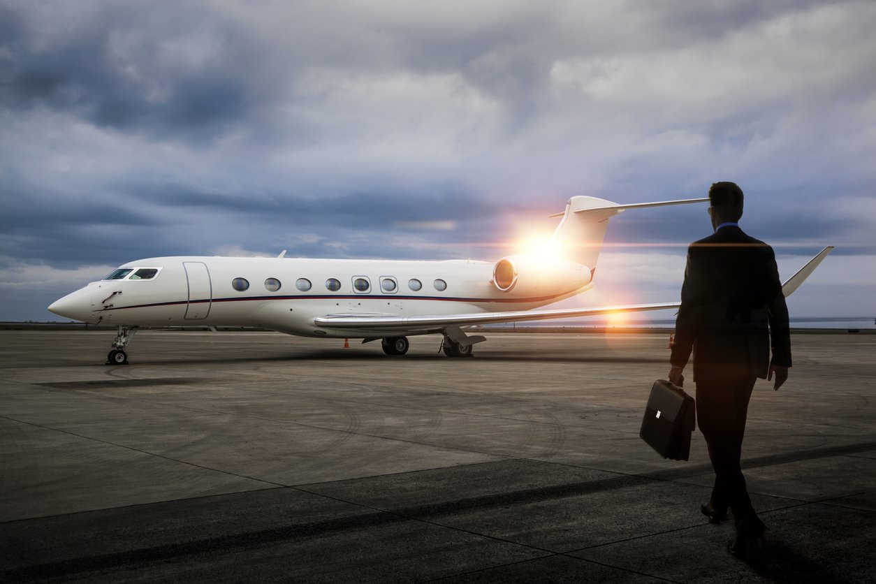 pilot walking towards an airplane