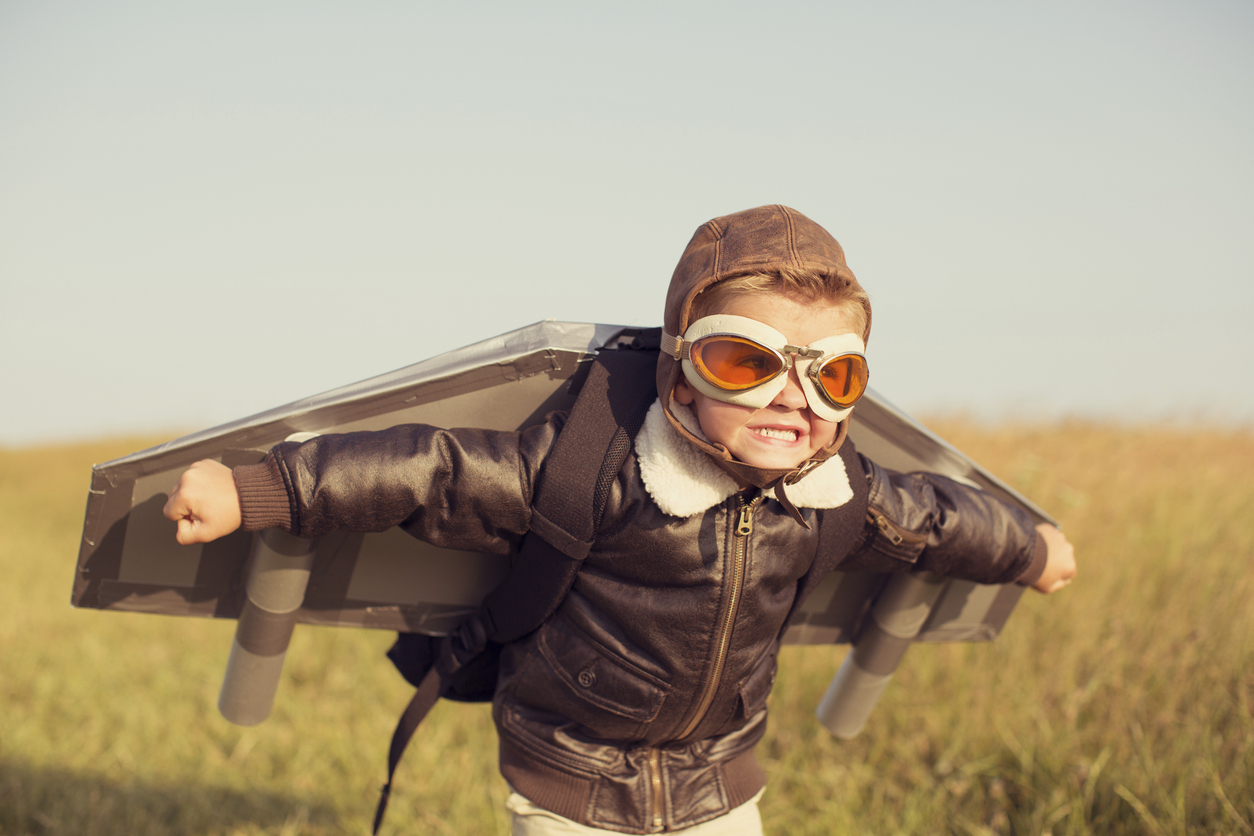 little boy trying to fly