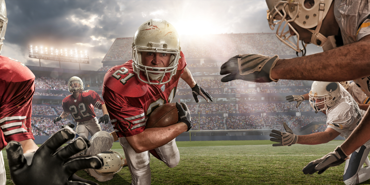 football player going for the touchdown