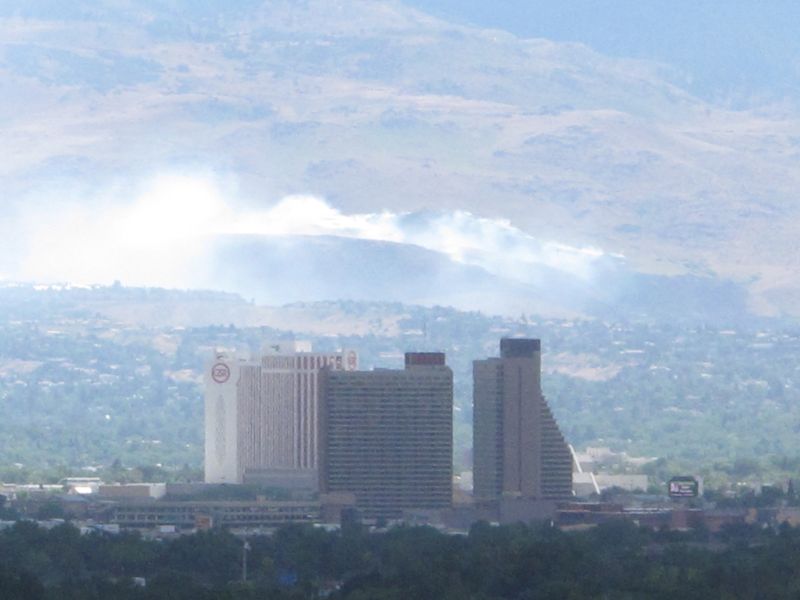 Smoke from a wind-driven brush fire on the southwest edge of Reno, Nev.