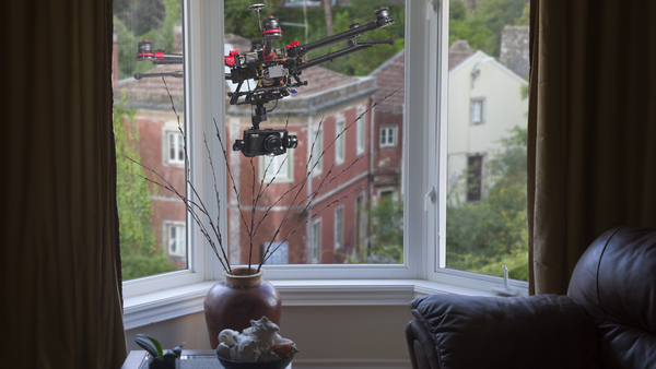 Drone hovering outside living room window