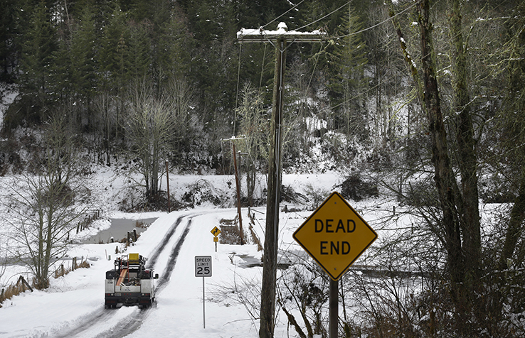 Power company truck driving in snow