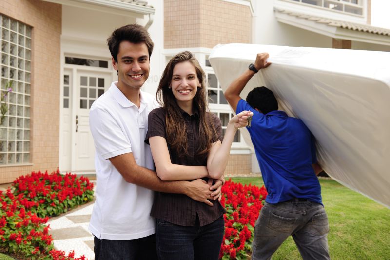 Young millennial couple moving into new home