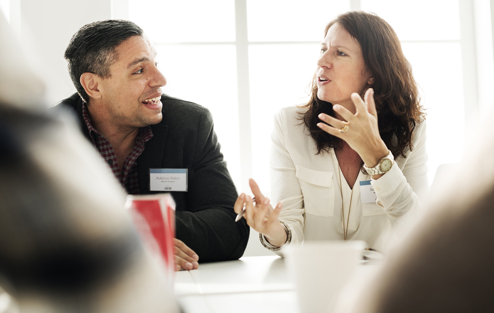 man and woman discussing claims issues